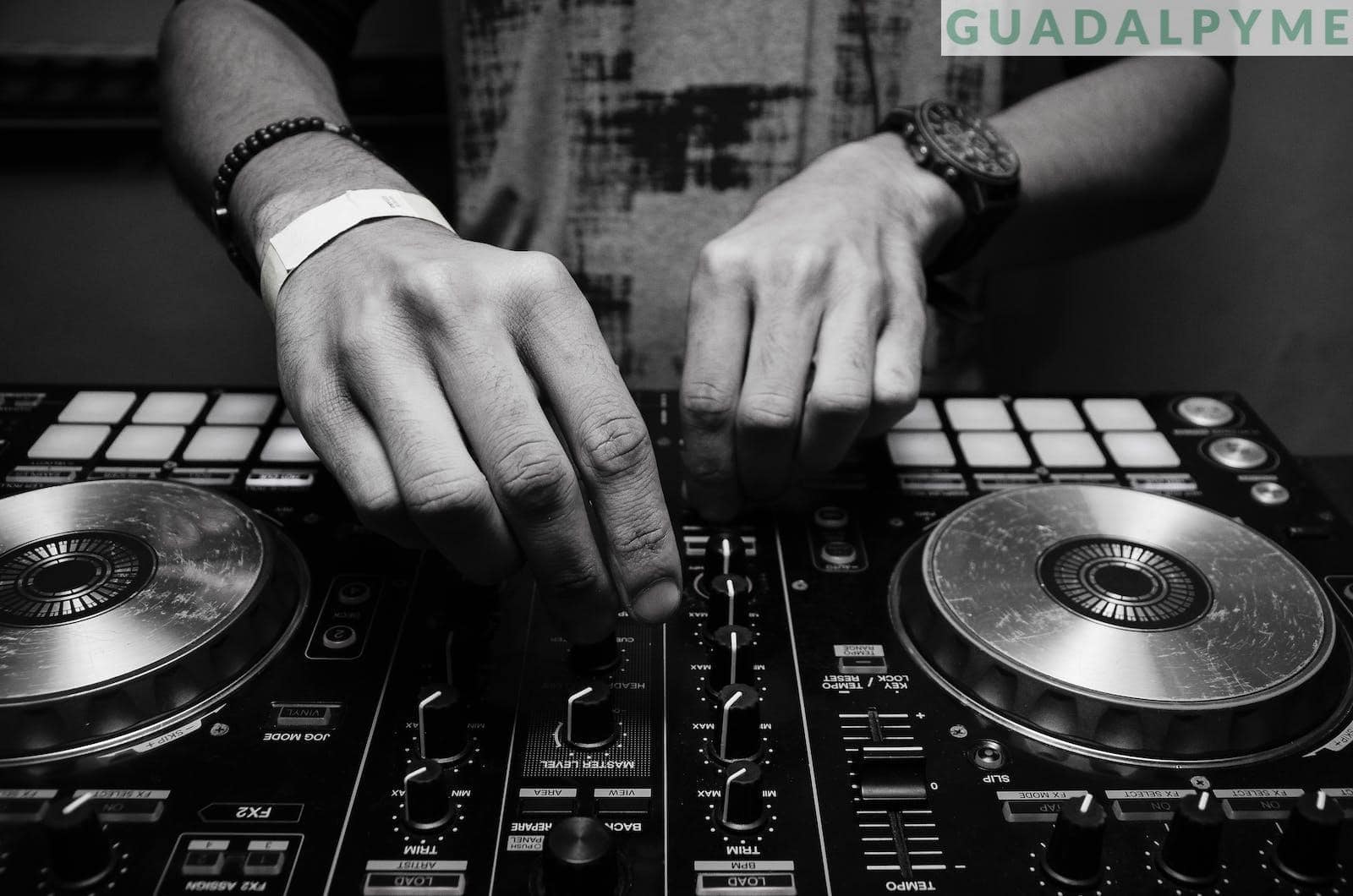 Grayscale Photography of Person Using Dj Controller