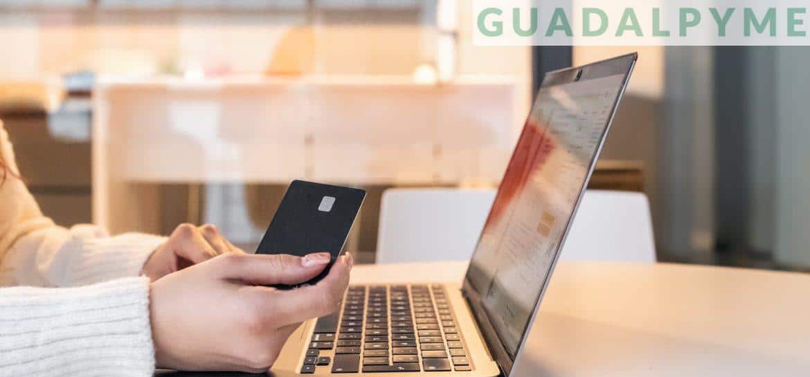 Woman with credit card and laptop