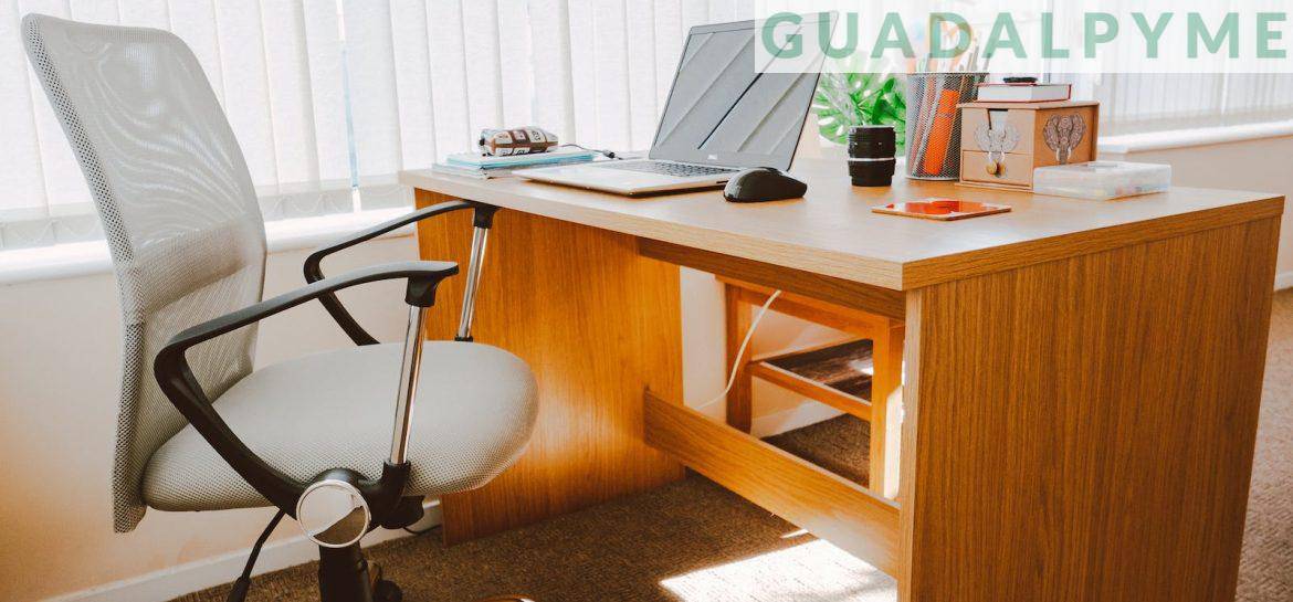 White Rolling Armchair Beside Table
