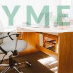 White Rolling Armchair Beside Table